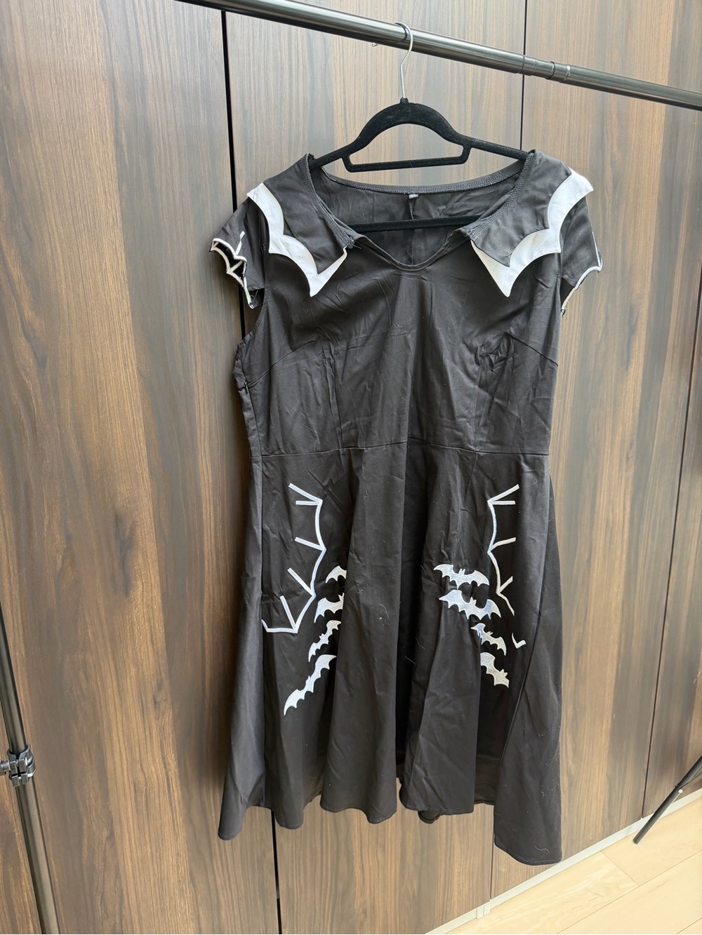 Black Dress with White Bat Accent
